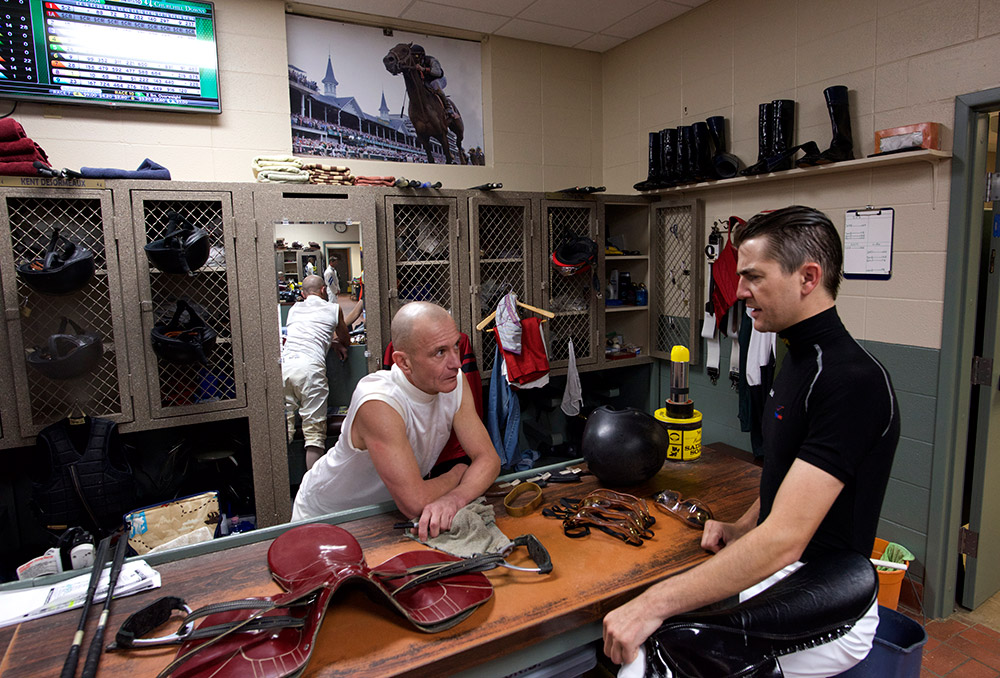 Hernandez talks to Hall of Fame jockey Calvin Borel (left) about his saddle at Churchill Downs on Thursday. Hernandez and Borel are connected for having both ridden 2009 Horse of the Year Rachel Alexandra during her legendary run.