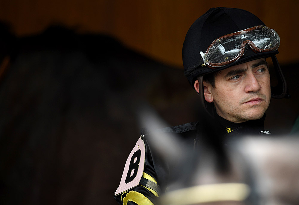 Hernandez takes a moment before Race 6, the Mercer Classic, at Churchill Downs on Thursday. Hernandez has raced more than 1,200 horses during his long career.