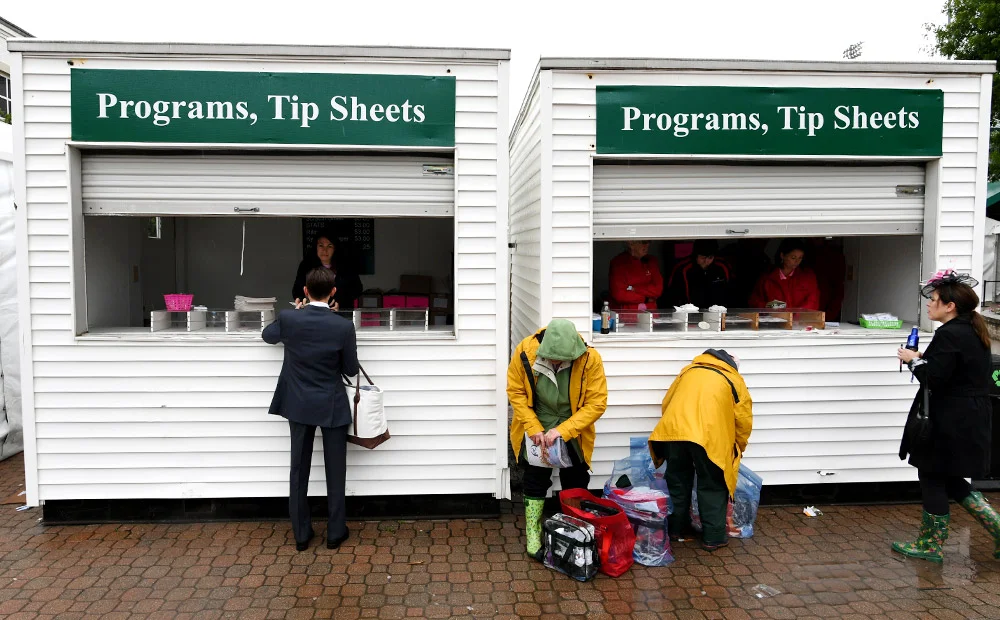 Before leaving the Downs on Friday, Hernandez purchases an Oaks program.