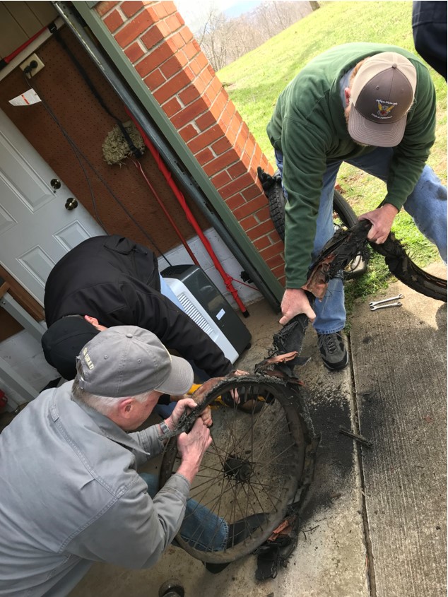 Front Tire Removal Team Effort With Sawzall