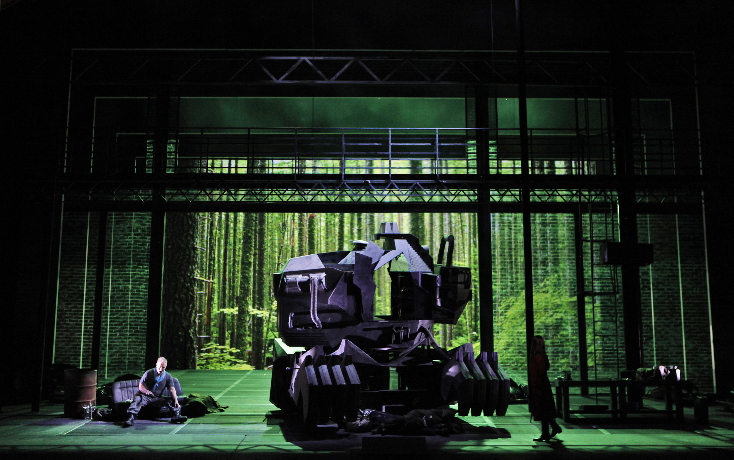 Siegfried rests pondering next steps after dispatching the dragon (the form taken by the giant, Fafner, who along with Mime, lies expired in front of the dragon). Photo courtesy of the Washington National Opera/Kennedy Center.