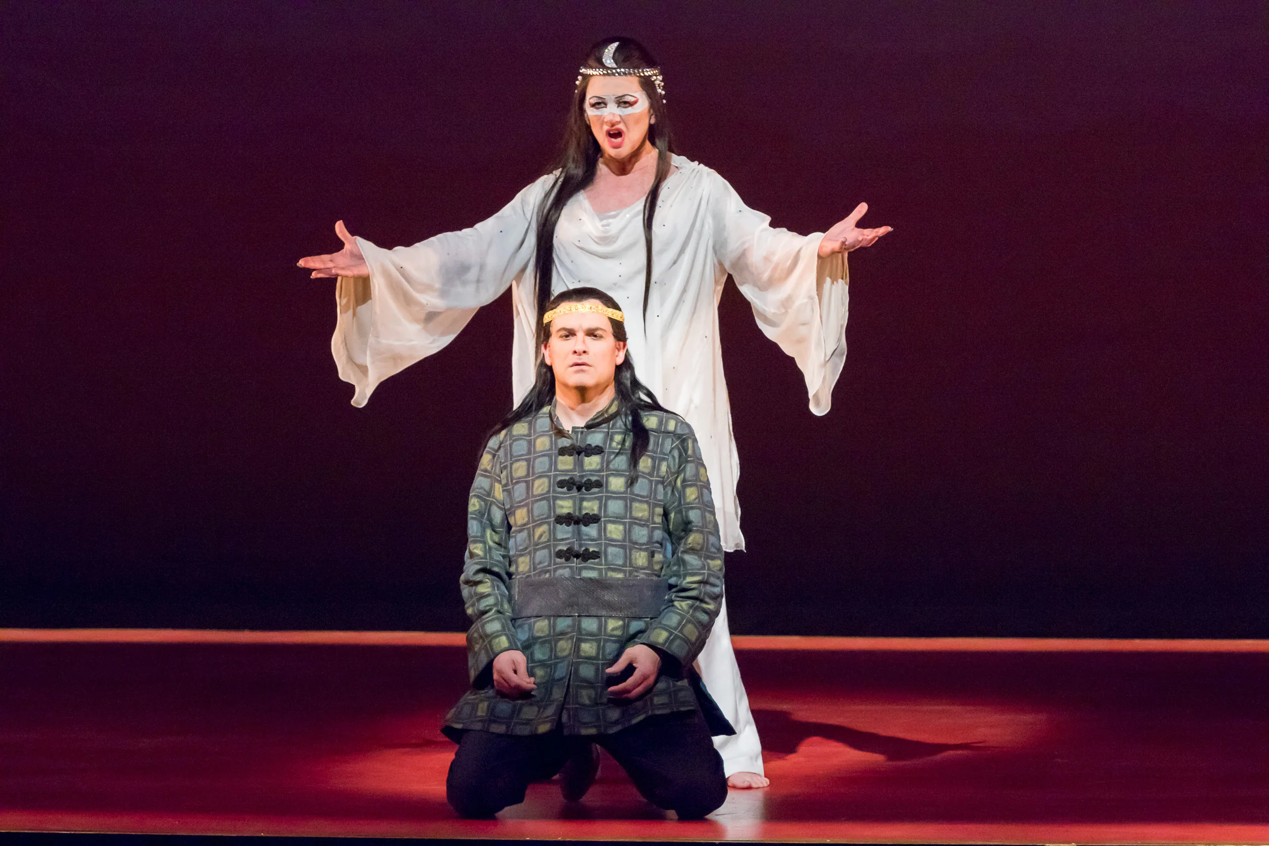 Turandot, Kelly Cae Hogan, stands above Prince Calaf, Derek Taylor. Photo by Ben Schill Photography; courtesy of Virginia Opera.