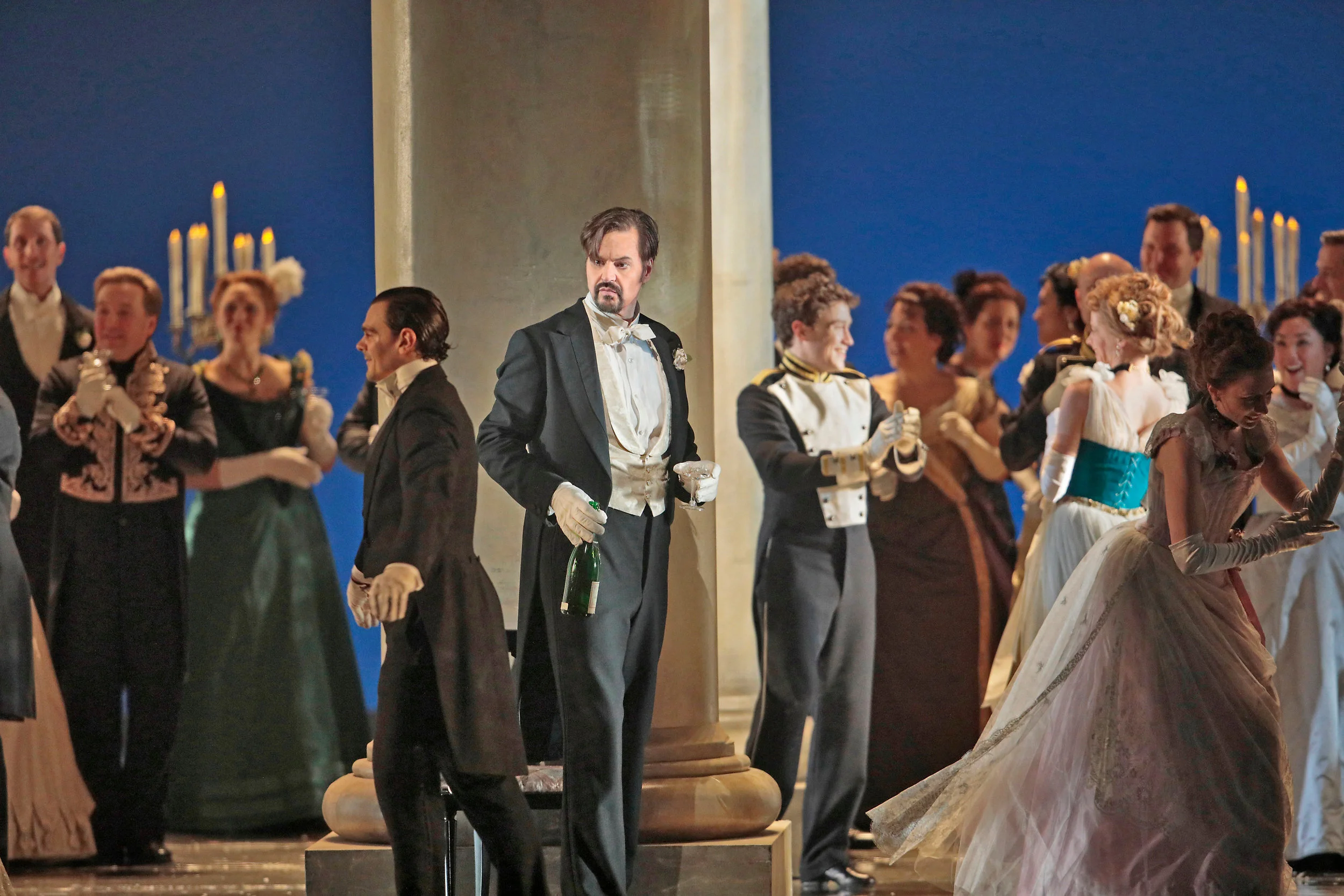 Peter Mattei as Onegin at an aristocratic party . Photo by Ken Howard; courtesy of the Metropolitan Opera.