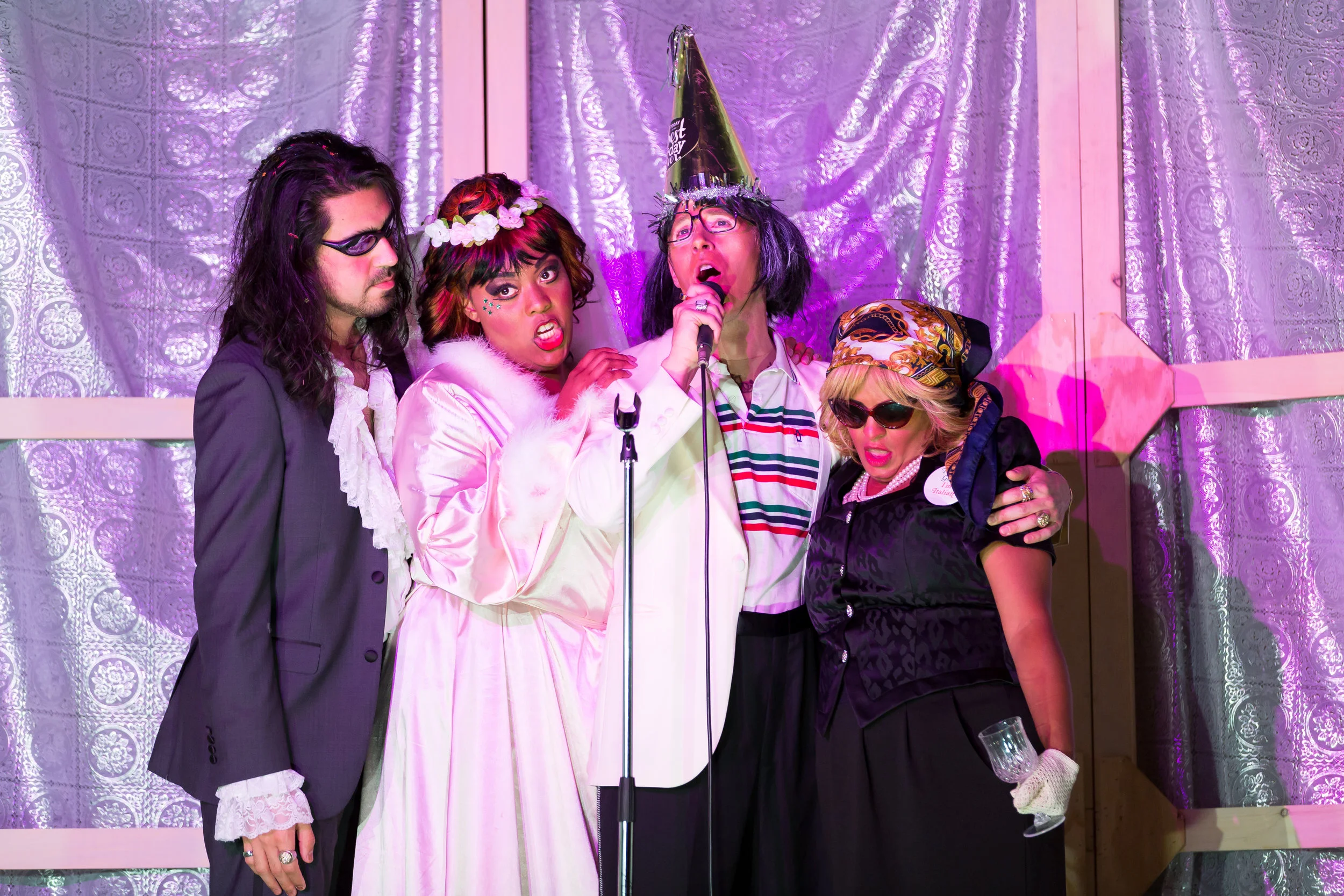 From Bastianello , first scene, Richard Ollarsaba, the groom, Zoie Reams, the bride, Shea Owens, the father, and Summer Hassan, the mother; photo by Scott Suchman and courtesy of Wolf Trap Opera.