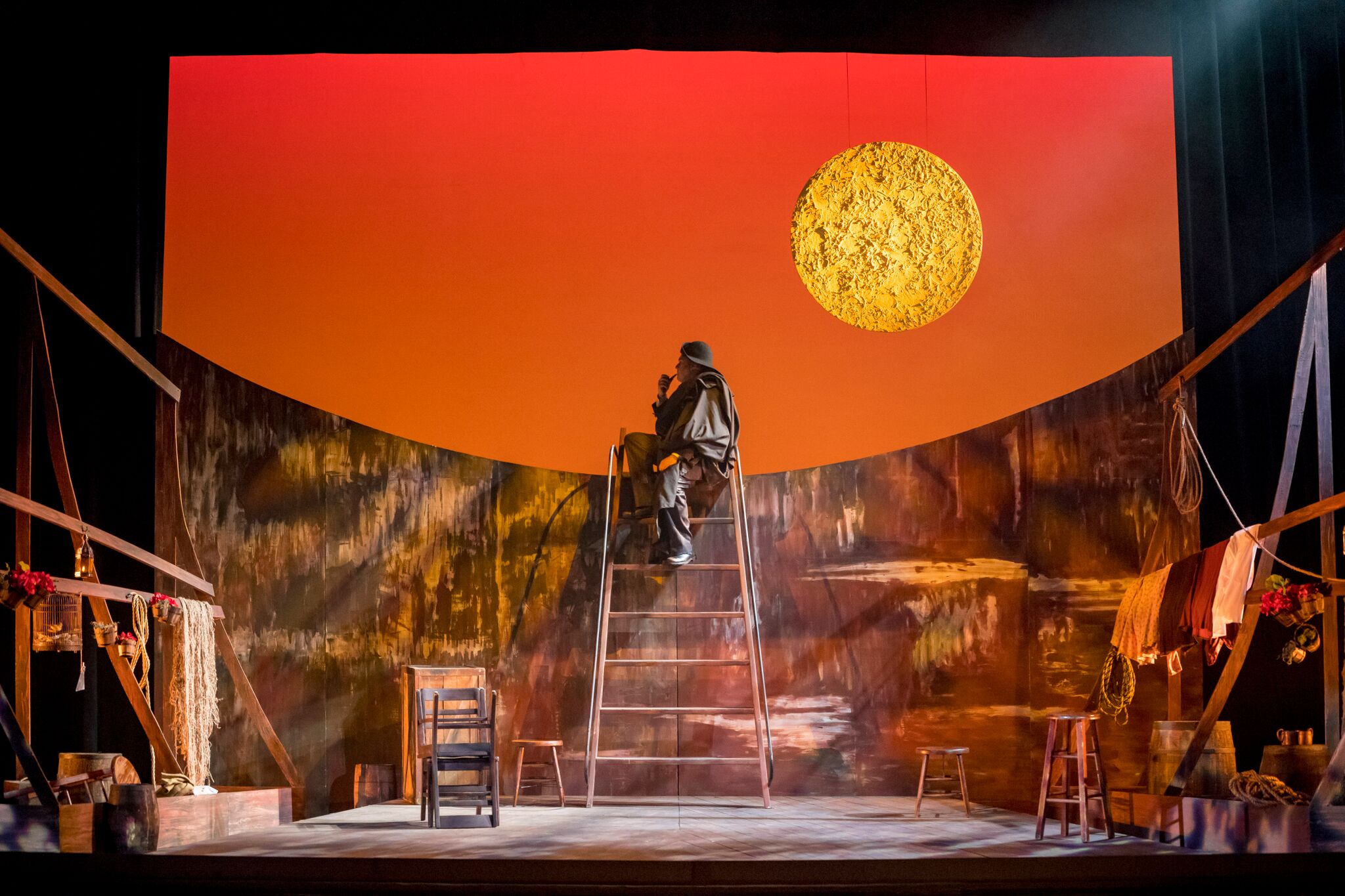 Setting the mood, Il Tabarro , begins with Michele (Grant Youngblood) sitting atop his barge as the sun sets. Photos by Moonloop Photography; courtesy of OperaDelaware.