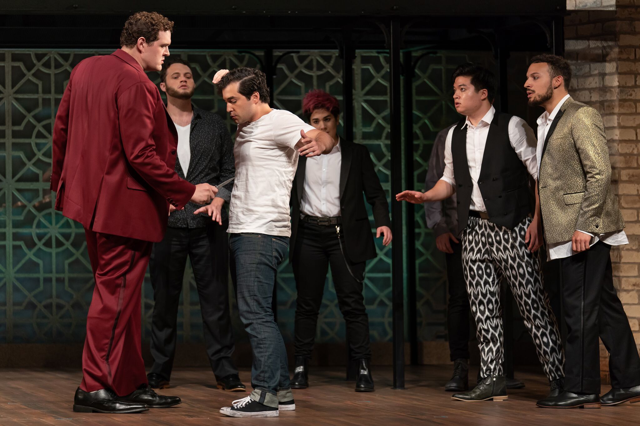 Tybalt (Richard Trey Smagur) confronts Romeo (Alexander McKissick) with a knife while onlookers are, l to r, Mercutio (Thomas Glass), Stephano (Amy Rosen), Duke Kim, and Cory McGee. Photo by Scott Suchman; courtesy of Wolf Trap Opera.