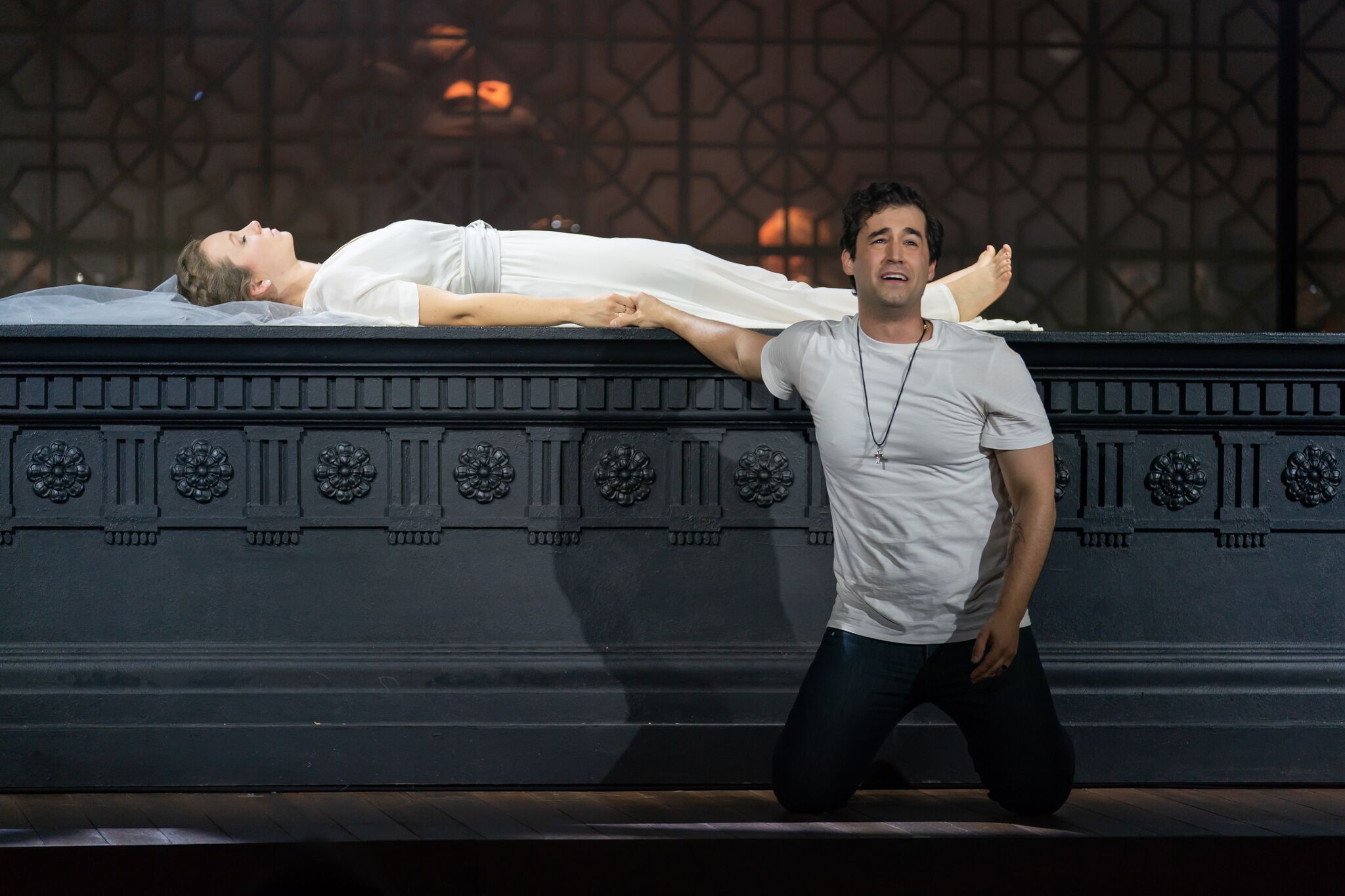 Romeo (Alexander McKissick) believes a sleeping Juliet (Madison Leonard) to be dead. Photo by Scott Suchman; courtesy of Wolf Trap Opera.
