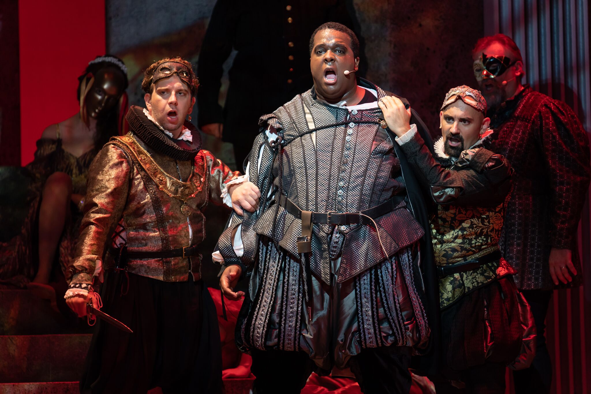Johnathan McCullough as Marullo, Joshua Conyers as Count Monterone, and Nicholas Nestorak as Matteo Borsa, as the two courtiers restrain the enraged Count. Photos by Scott Suchman; courtesy of Wolf Trap Opera.