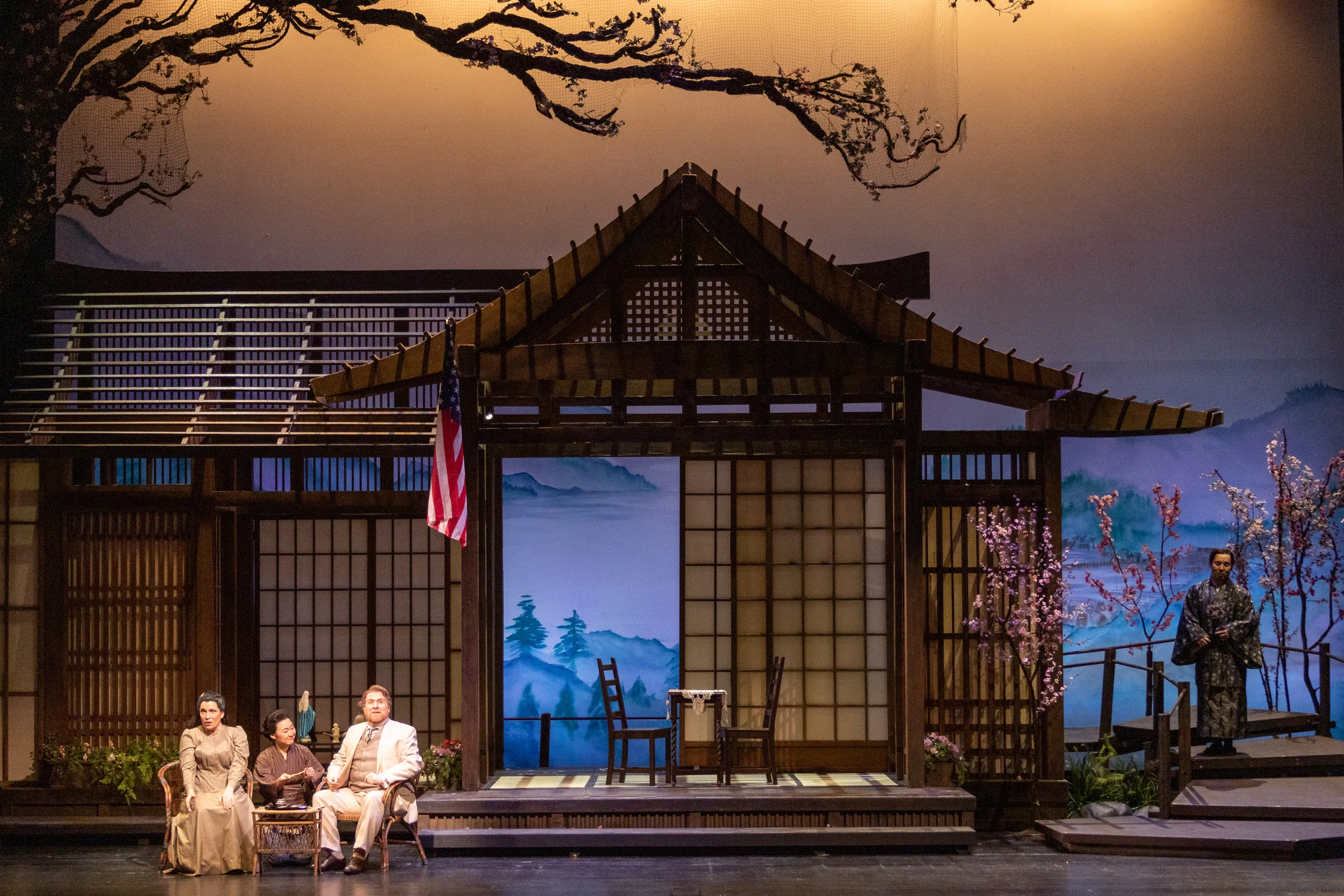 Cio-Cio-San (Danielle Pastin) and her maid Suzuki (Kristen Choi) listen as Consul Sharpless (Levi Hernandez) tries to warn Cio-Cio-San while Goro (Julius Ahn) listens in the background. Photo by Ben Schill Photography; courtesy of Virginia Opera.