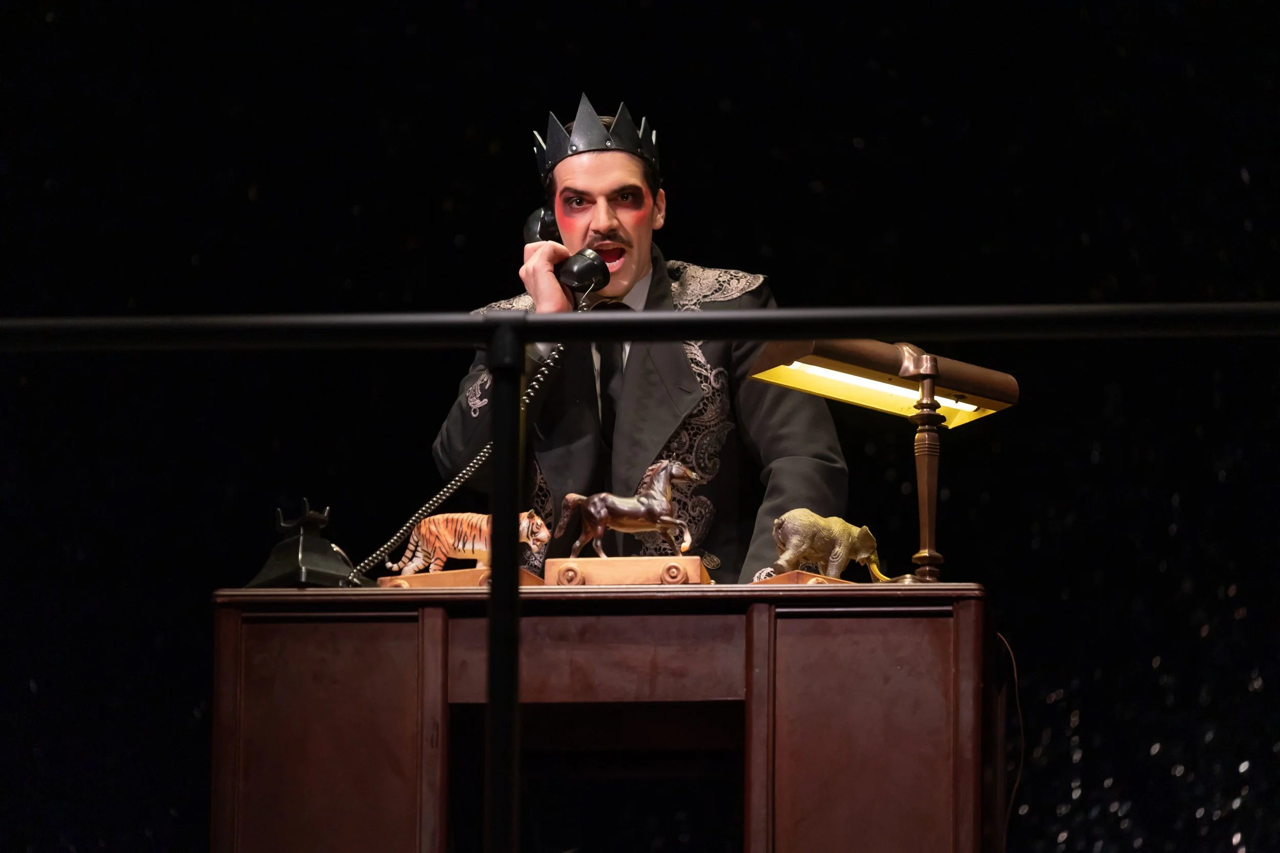 Emperor Overall (Ben Edquist) isolated and ruling from his office. Photo by Scott Suchman; courtesy of Wolf Trap Opera.