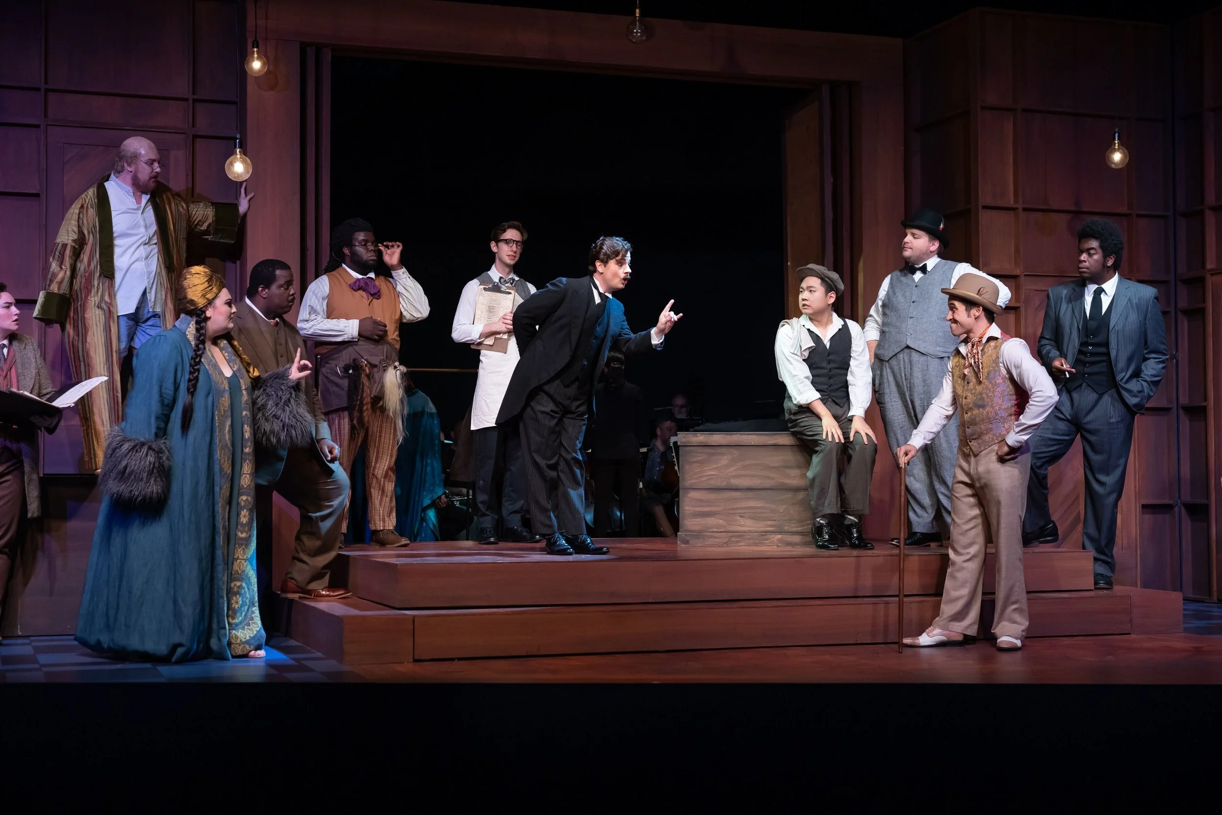 l to r : Lindsay Kate Brown (Composer), Ian Koziara (Tenor), Alexandria Shiner (Prima Donna), Joshua Conyers (Music Master), Wilford Kelly (Wigmaker), Jeremy Harr (Lackey), Conor McDonald (Major-Domo), Seiyoung Kim (Brighella), Victor Cardamone (Scaramuccio), Ian McEuen (Dancing Master) and Ron Dukes (Truffaldin) in the Prologue. Photo by Scott Suchman; courtesy of Wolf Trap Opera.