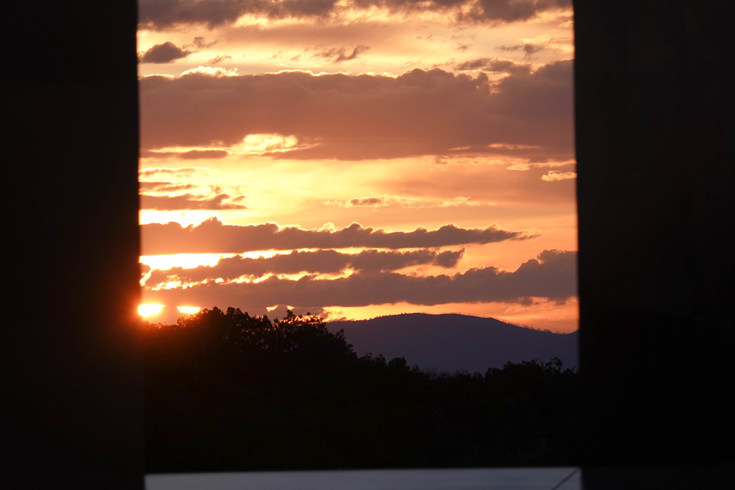 The sunset captured through the stage on our second night for Cosi fan tutte . Photo by Deb Rogers.