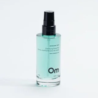 Spirulina Tonic Clarifying Face Mist in a clear bottle with a black spray cap