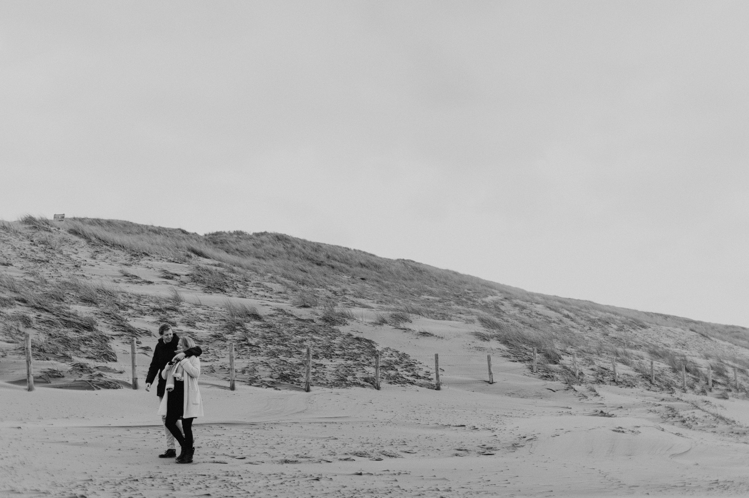 Couple walking on the beach of Bloemendaal