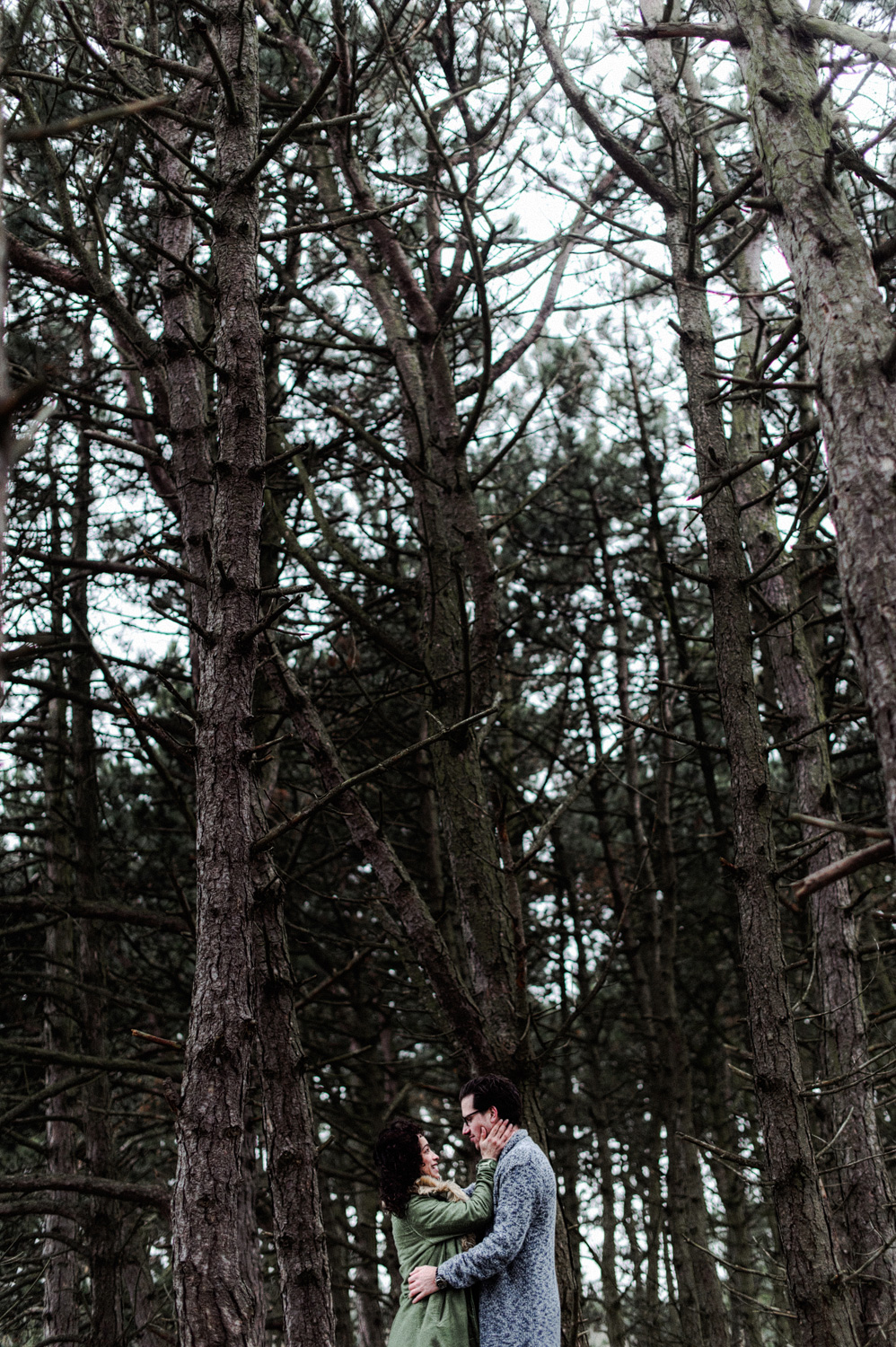 Couple facing each other in forrest environment