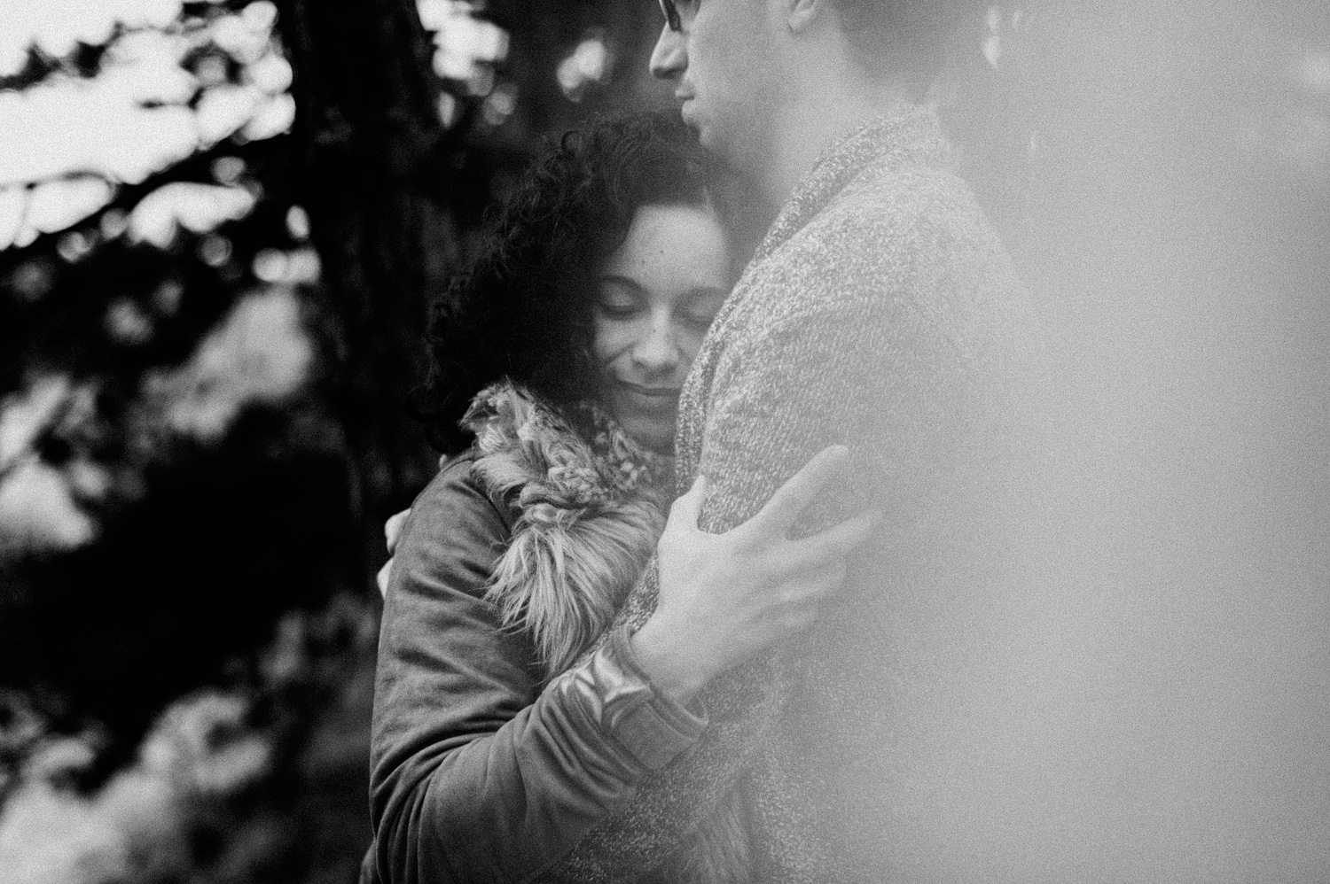 Girl holding her boyfriend in forrest