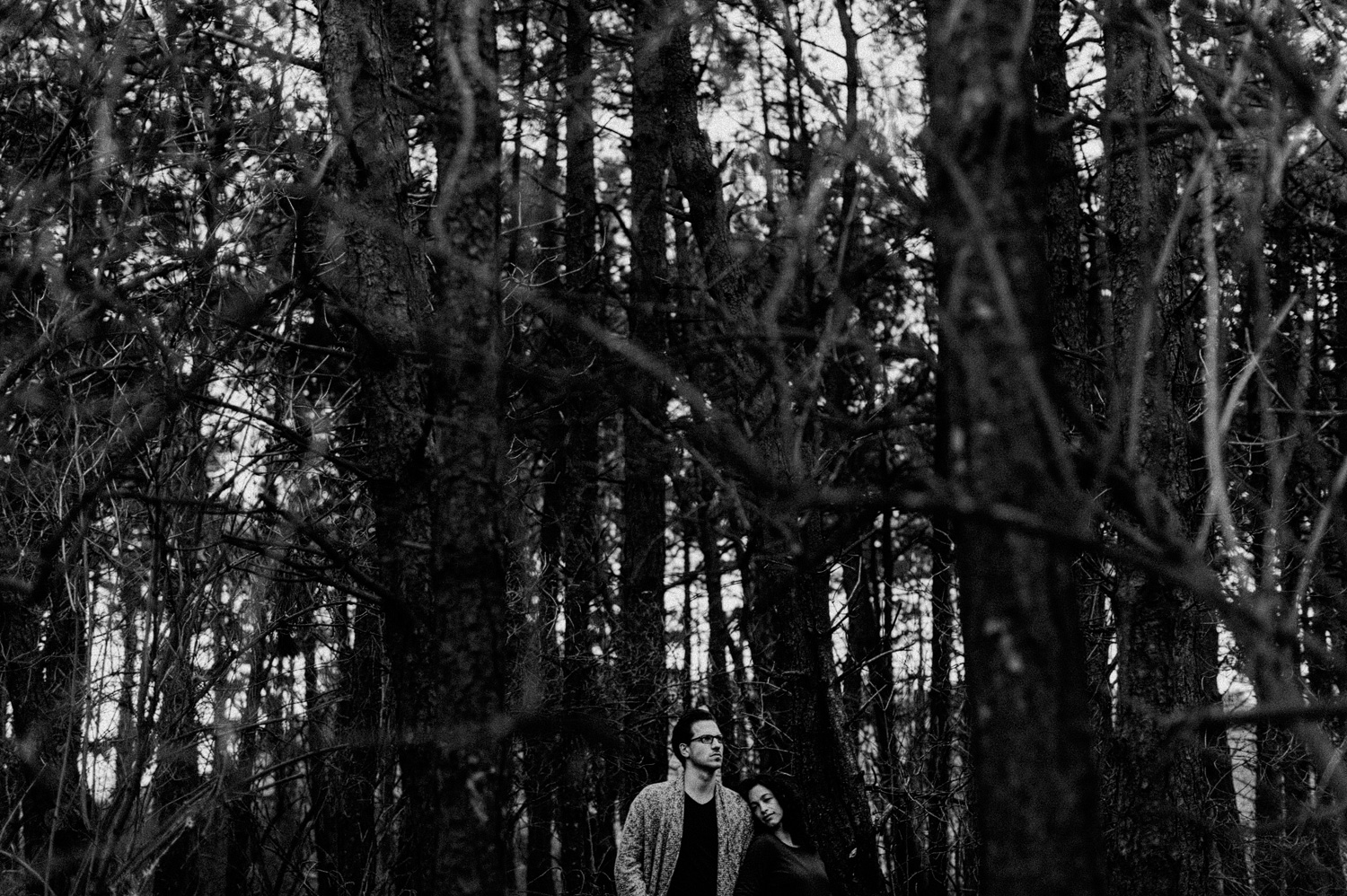 Couple hugging in forrest