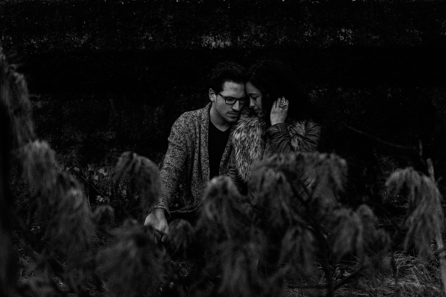 Couple sitting in forrest