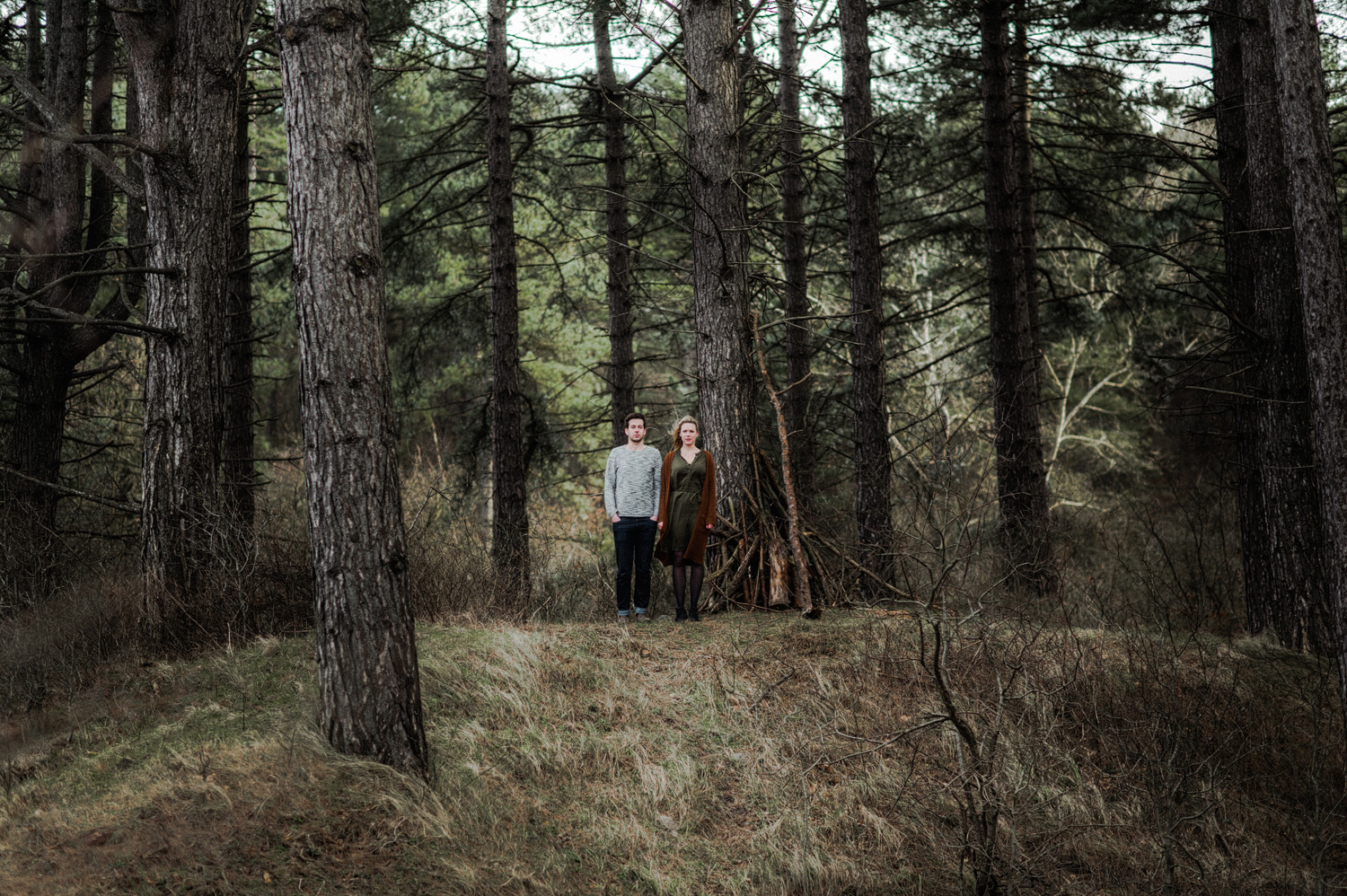 Couple far away in the forrest