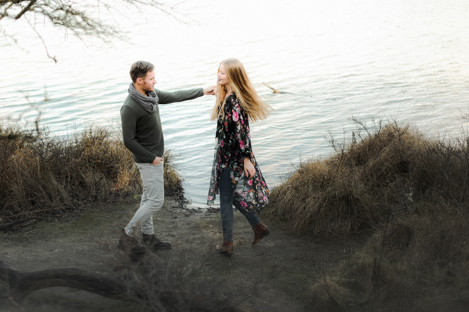 Couple dancing on shoreline