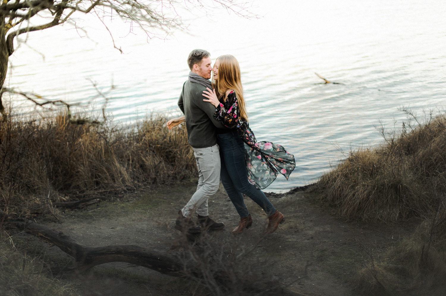Couple hugging in front of lake