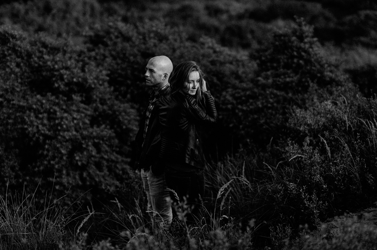 Couple standing in last sunlight