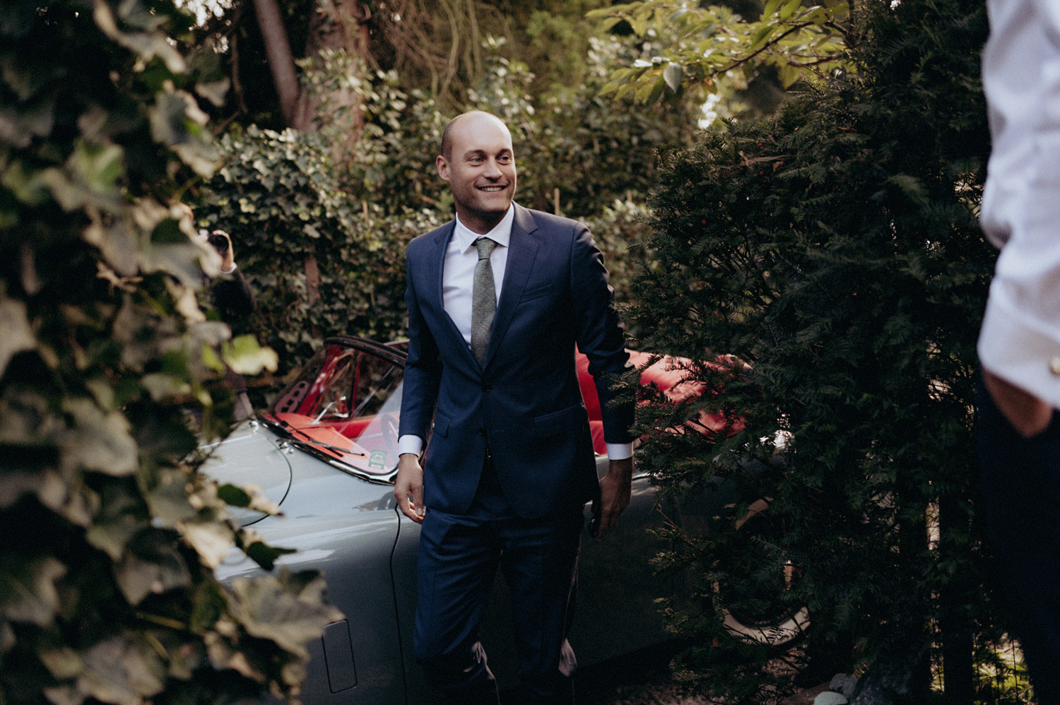 Groom arriving at parents house of bride