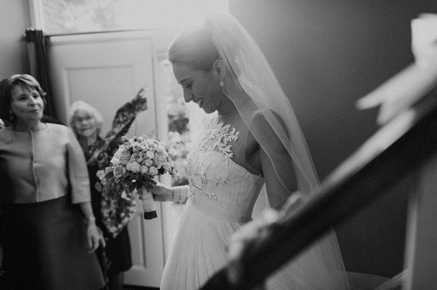 Bride walking down the stairs towards groom