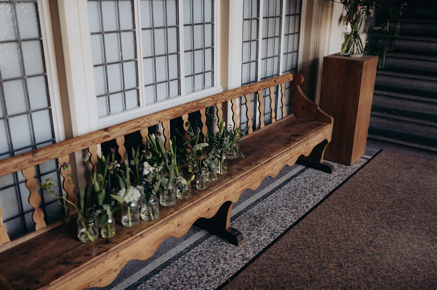 Church bench with wedding flowers