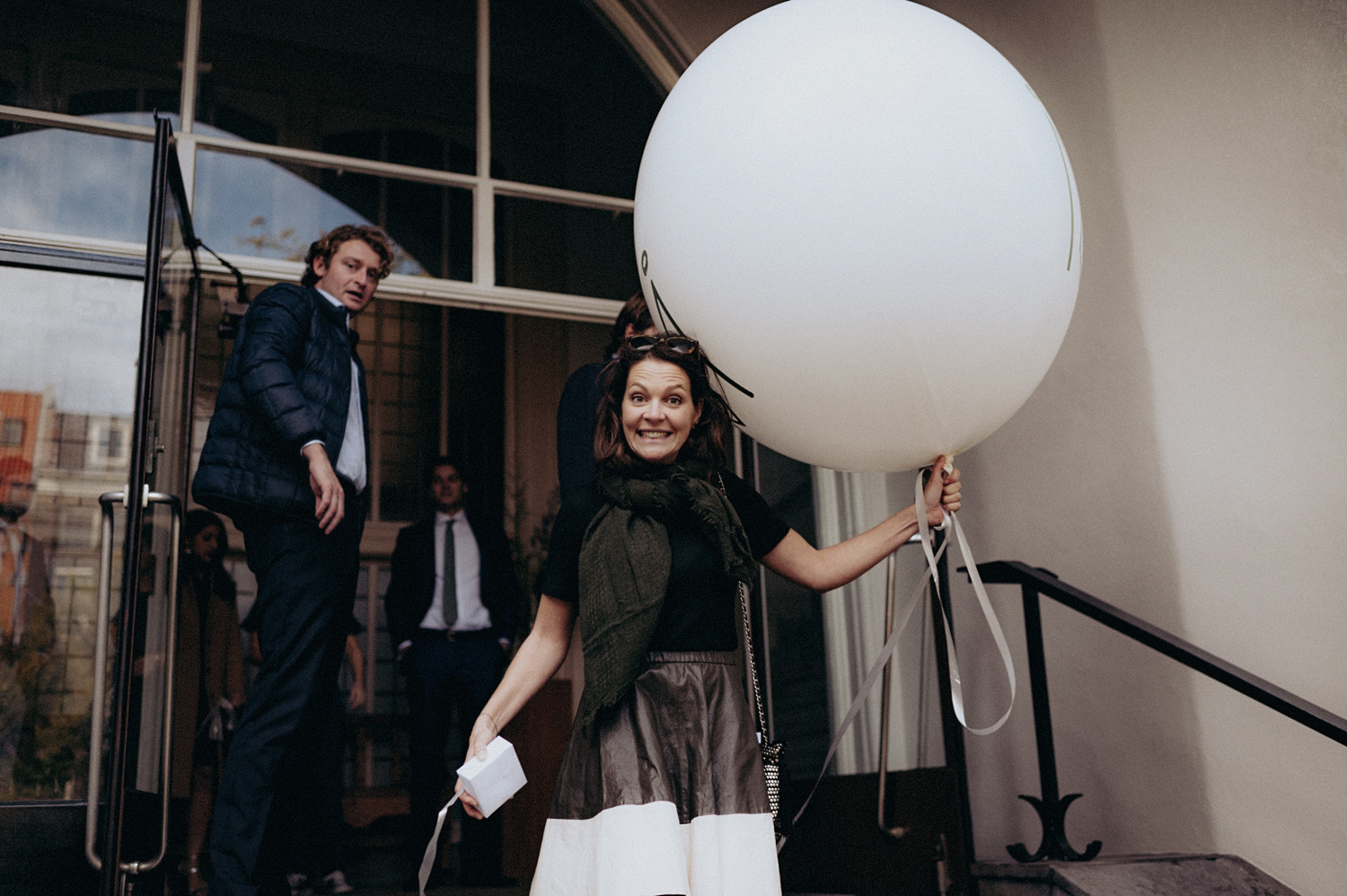 Wedding guest with huge balloon