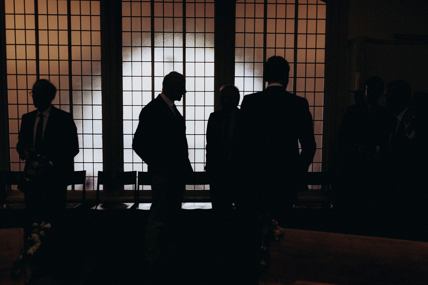 Silhouette shot of wedding guests inside Keizersgracht Kerk Amsterdam