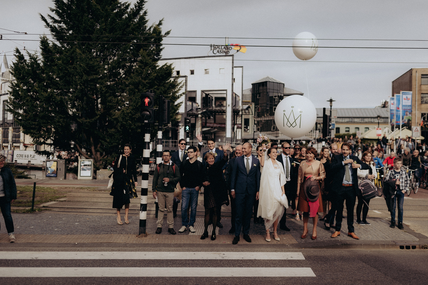 Wedding party waiting to cross the road in Amsterdam