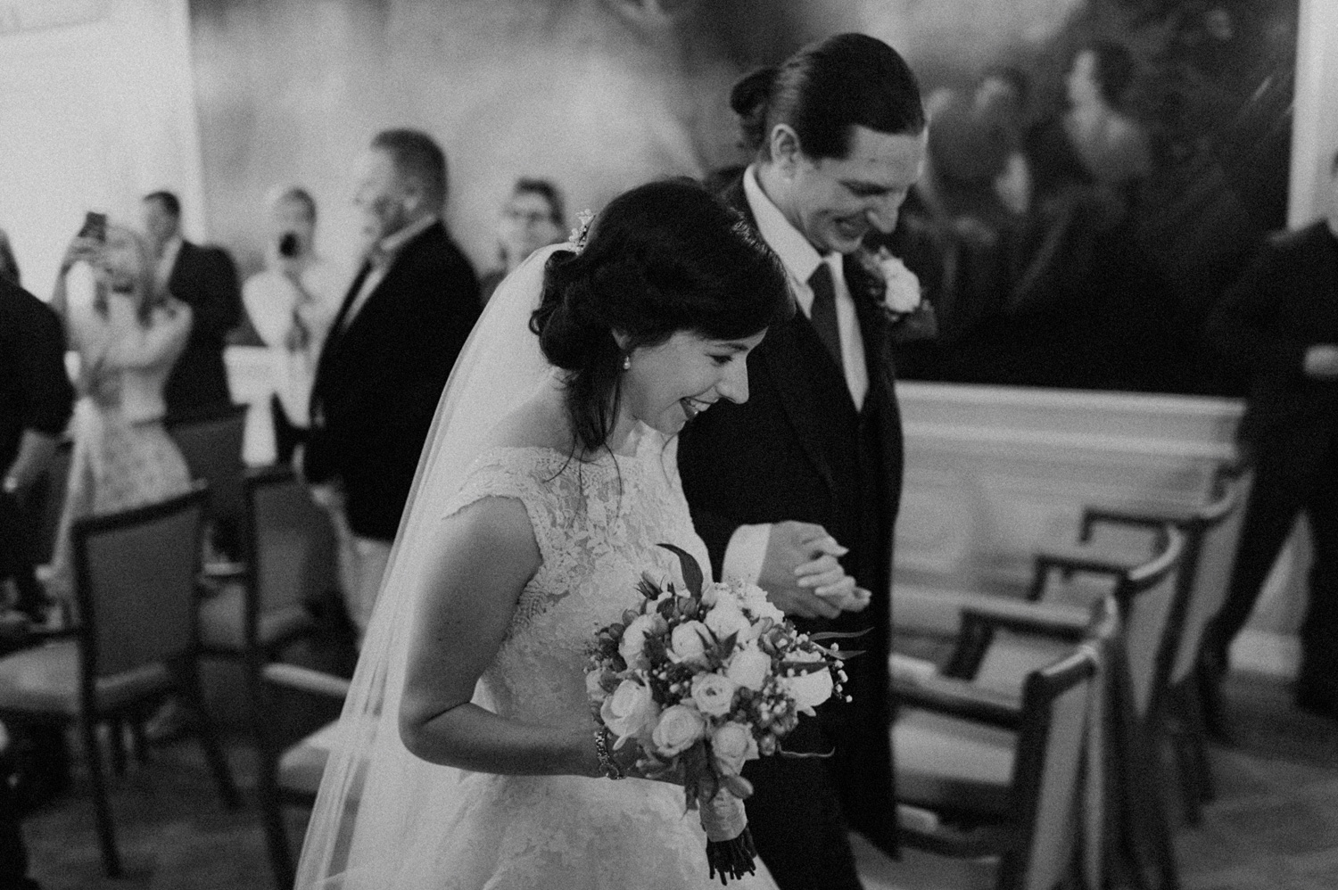 Bride and groom leaving the ceremony
