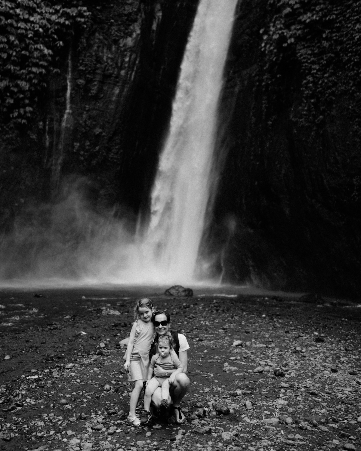 People in front of waterfall