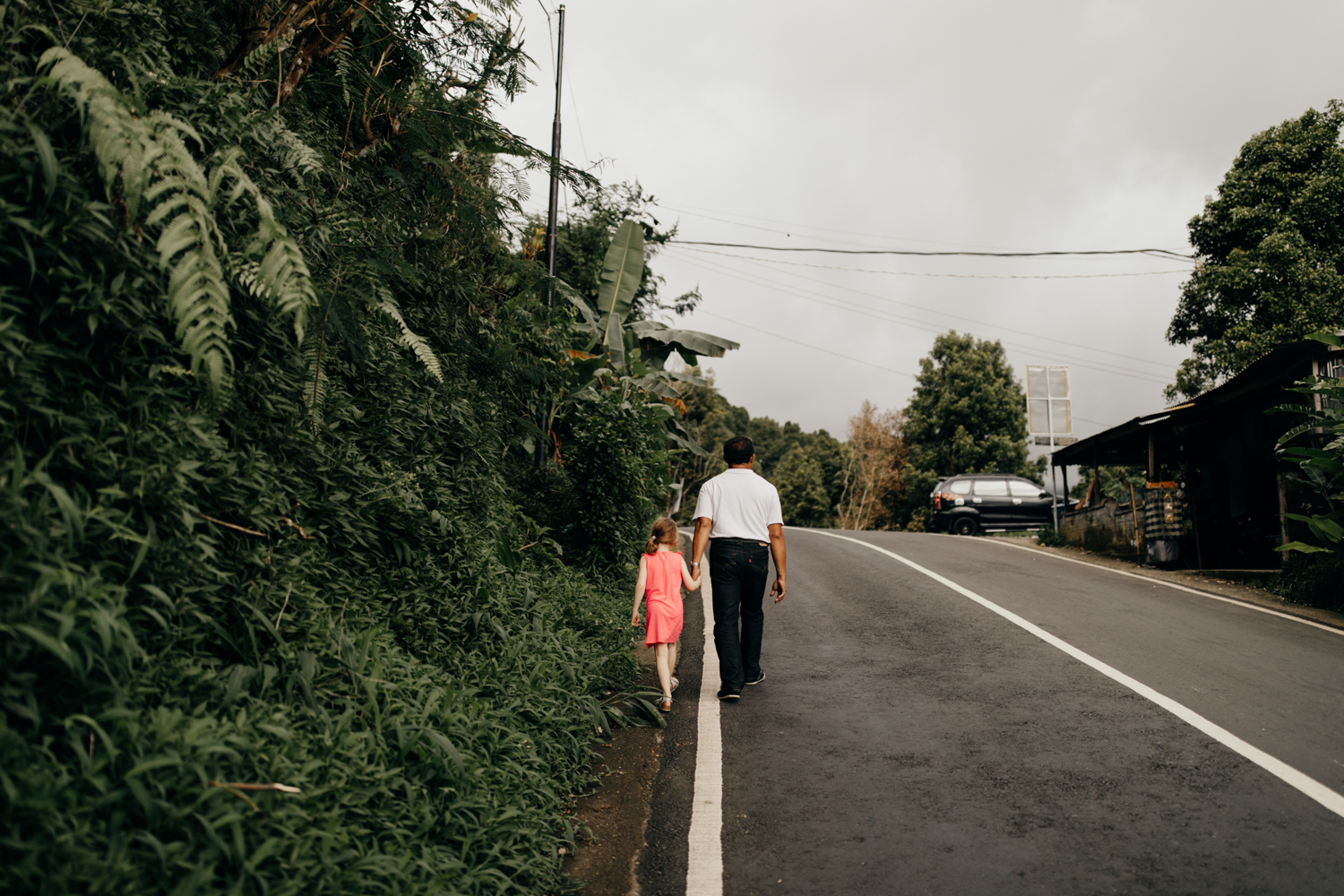 People walking next to road