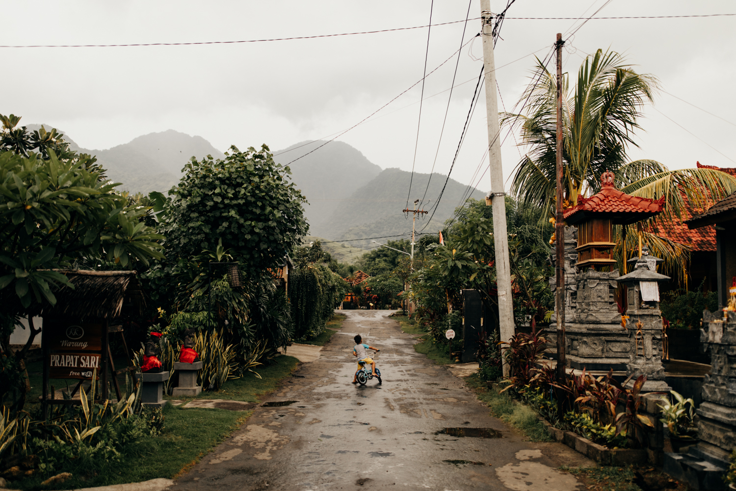 Kid on road with mountain in the background in Bali, Indonesia