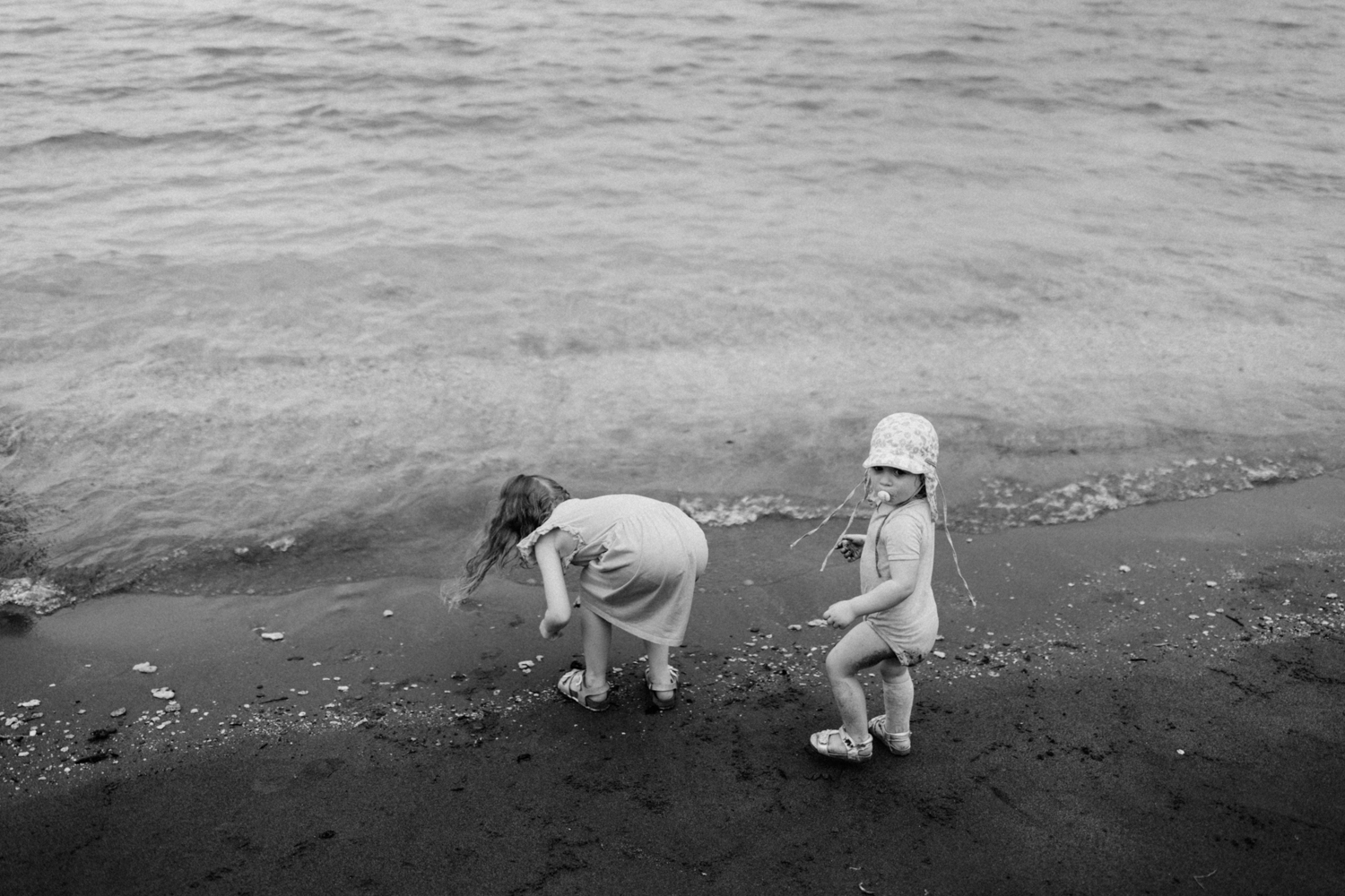 Kids looking for seashells at the beach