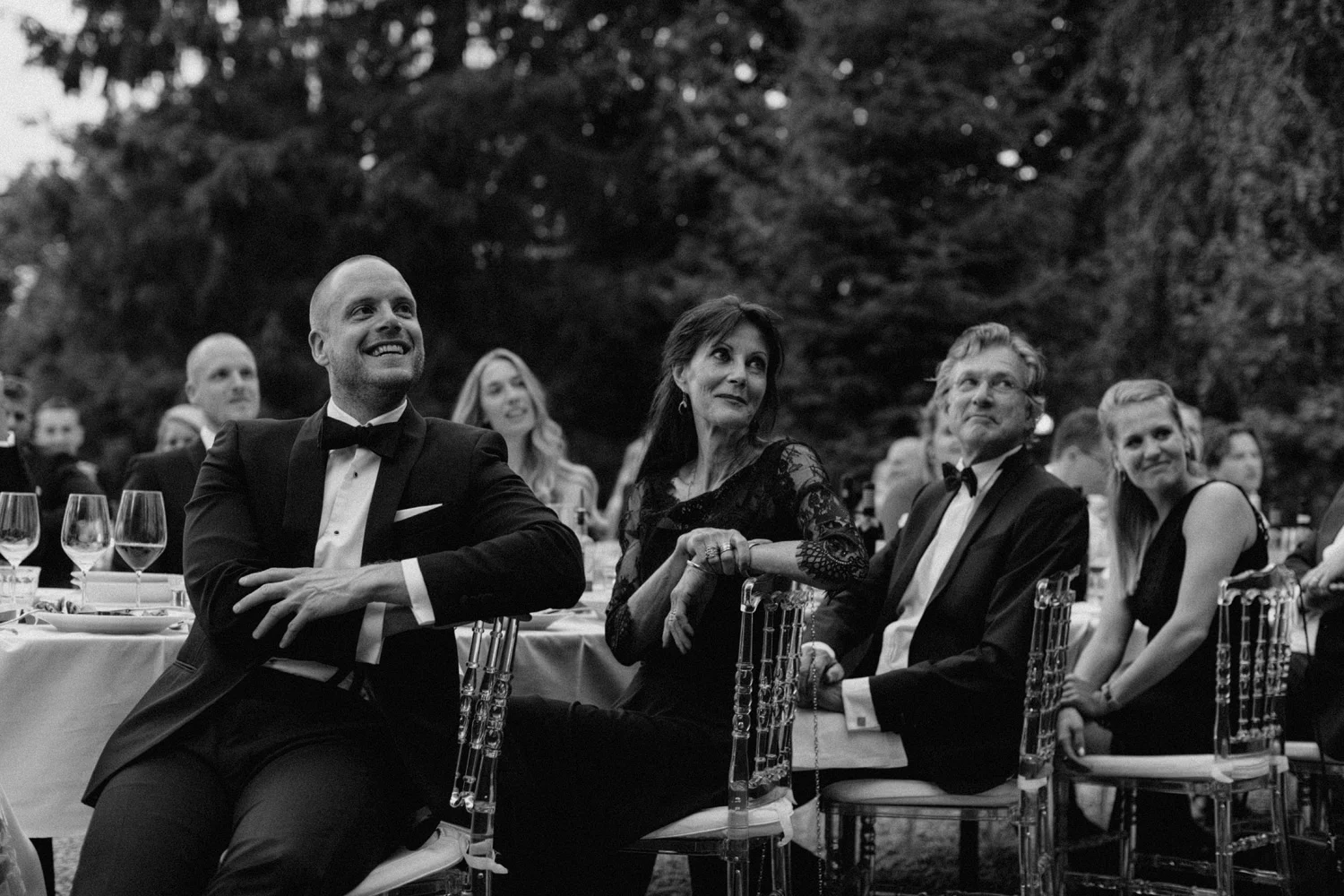 Groom laughing during speech at Chateau de Presseux