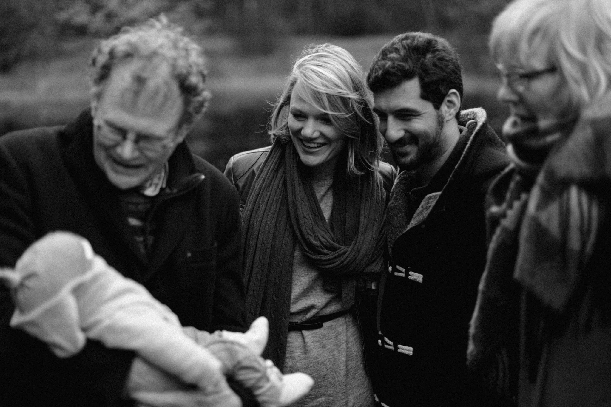 Family holding baby