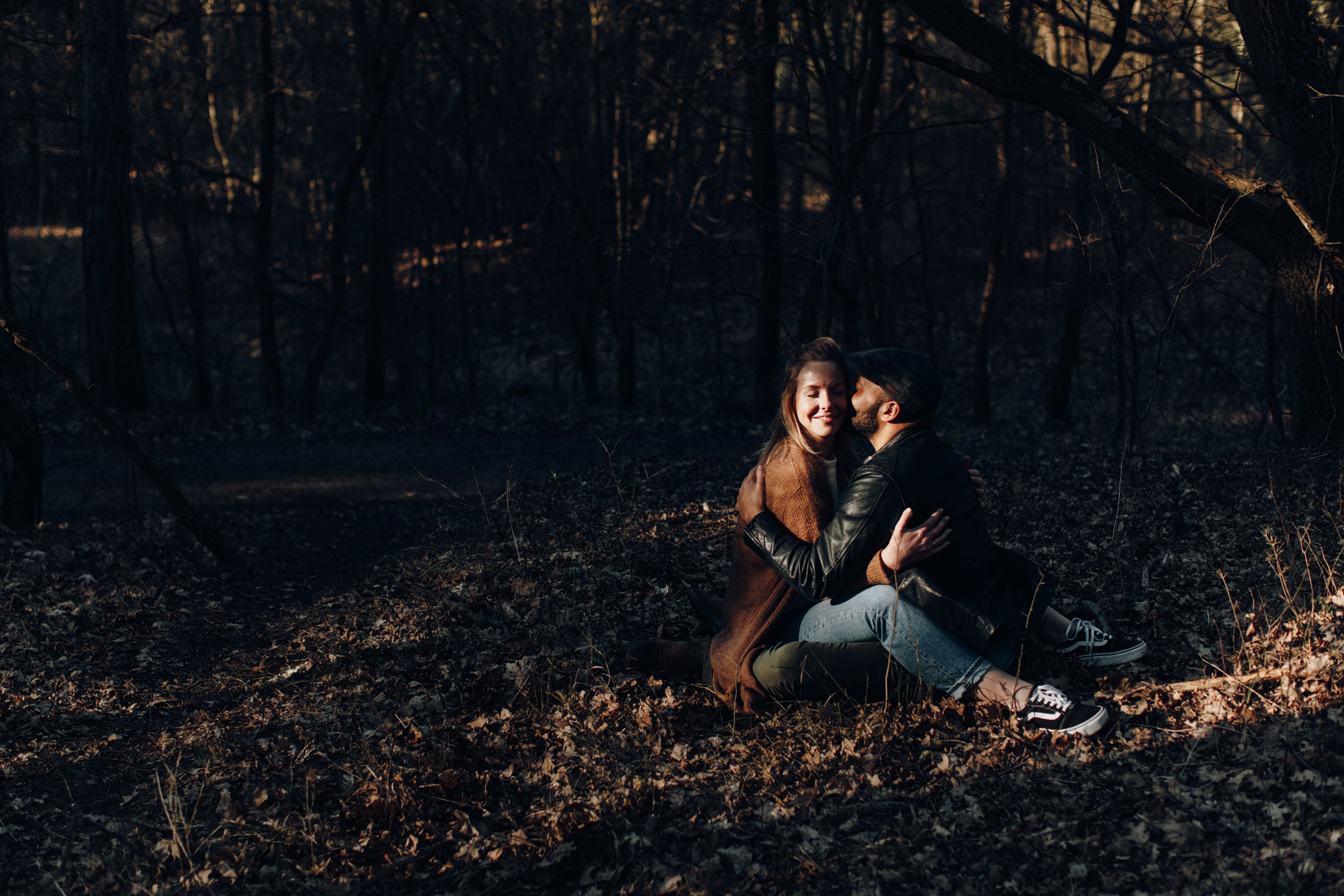 Couple sitting together in the sun in Kennemerduinen