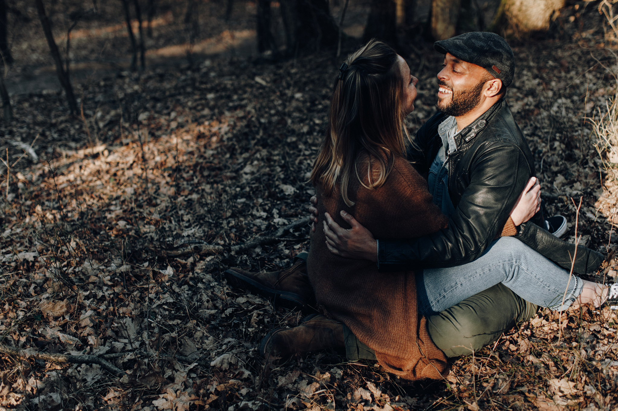Couple sitting together in the sun in Kennemerduinen
