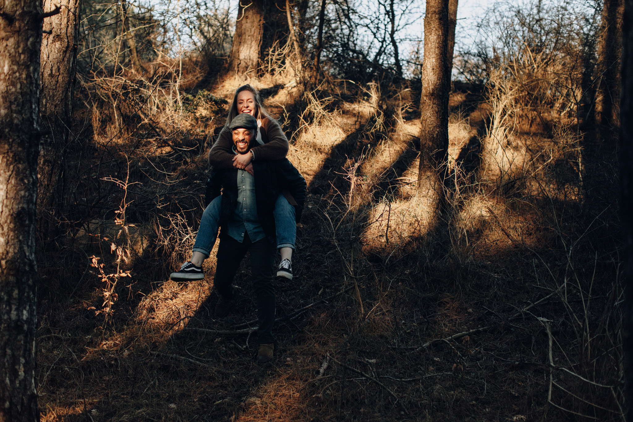 Couple walking in the light in dunes of Kennemerduinen