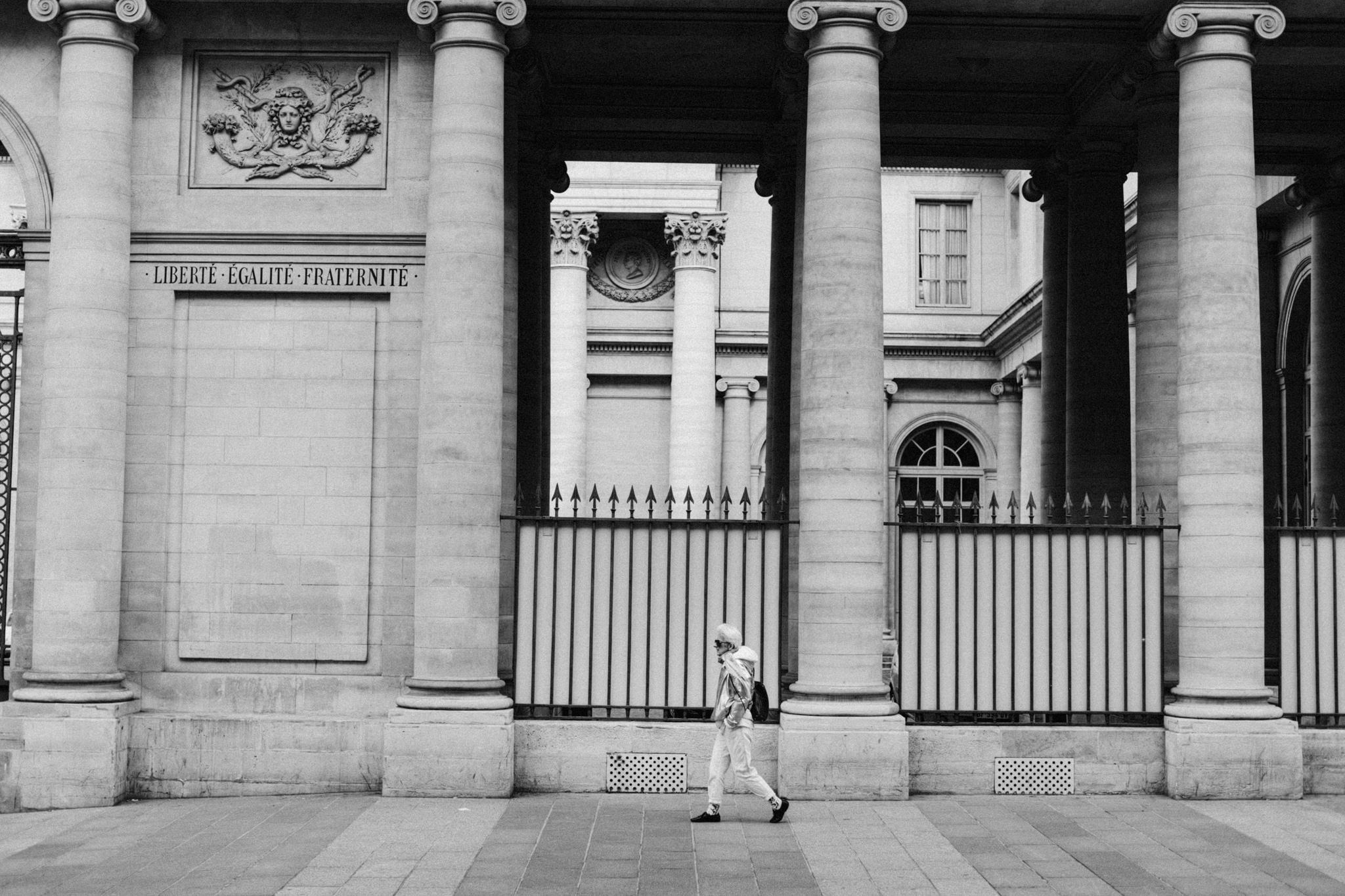 Person walking the streets of Paris, France