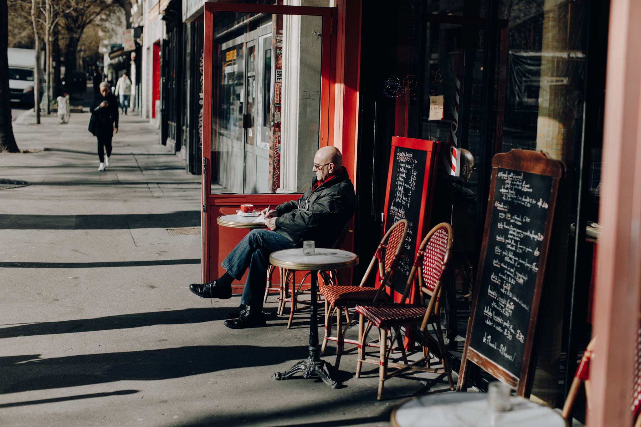 Man sitting on terrace in Paris, France