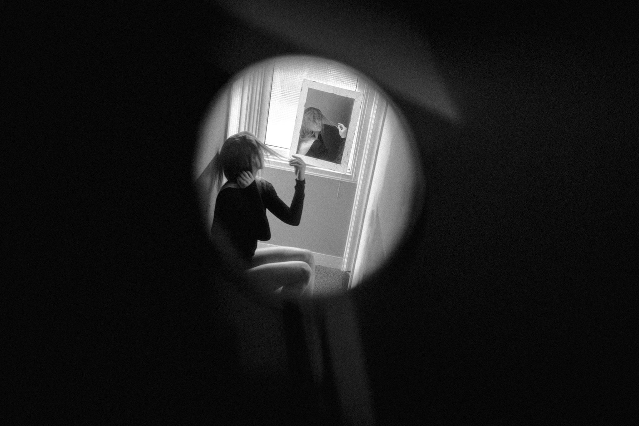 Portrait shot of girl in multiple mirrors