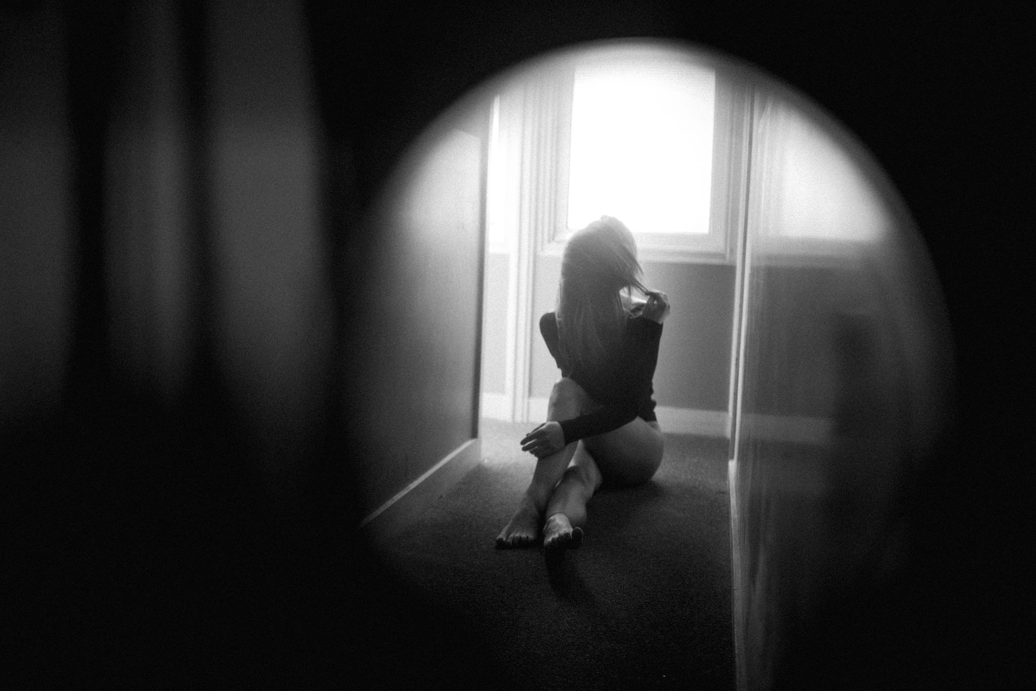 Portrait of girl shot in mirror, dark and moody