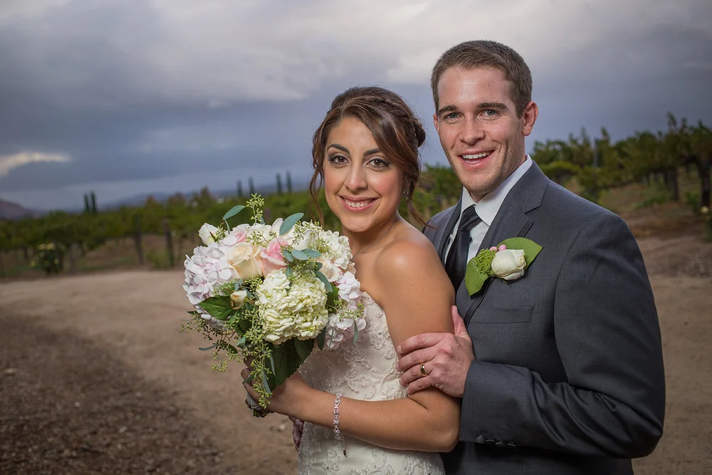 married couple at a vineyard