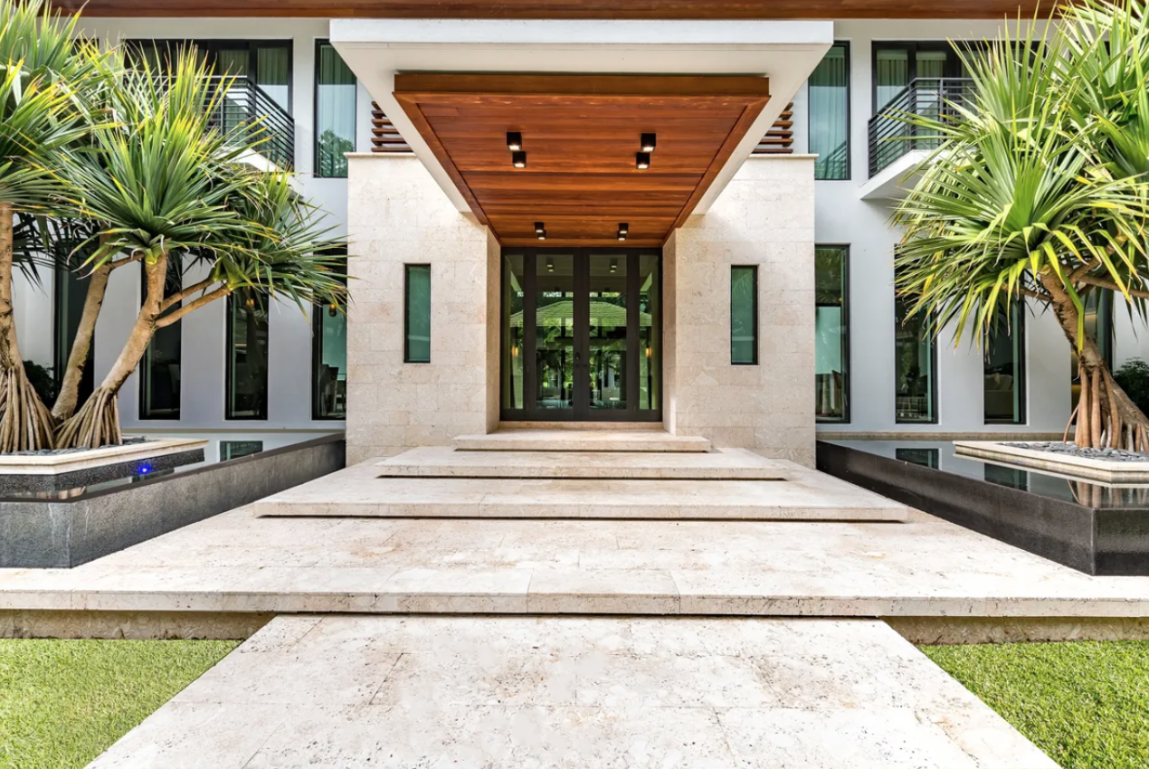 Stone entrance steps and a wood ceiling at the Gables Estates residence
