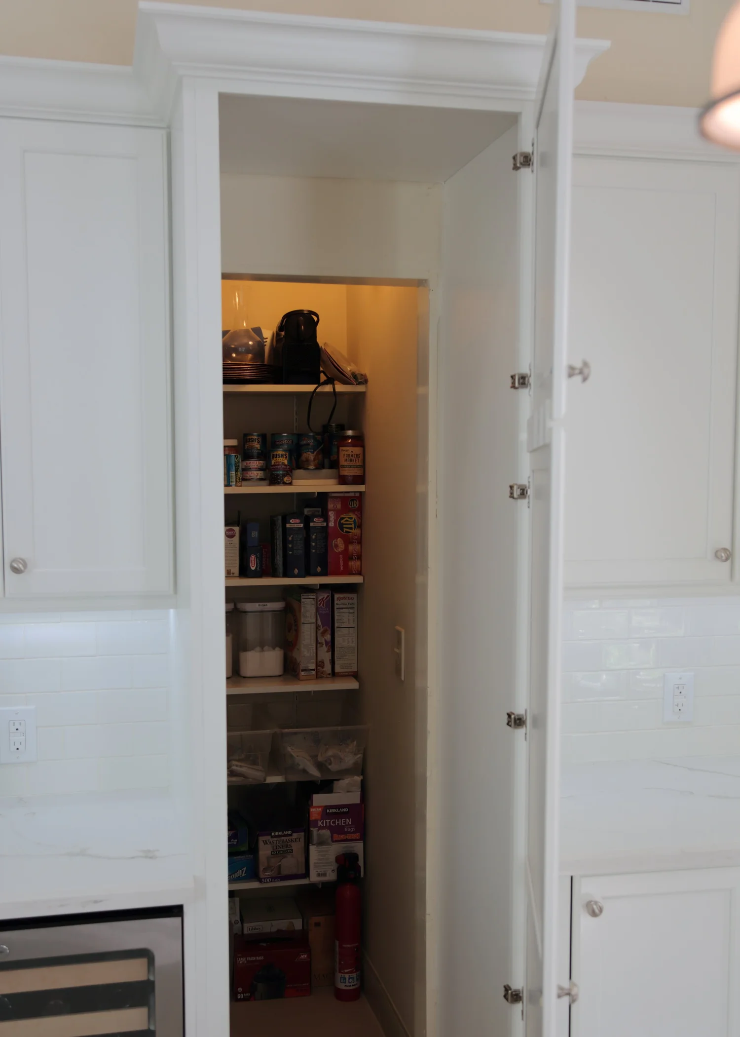 Eleet cabinetry concealing a walk-in pantry entrance
