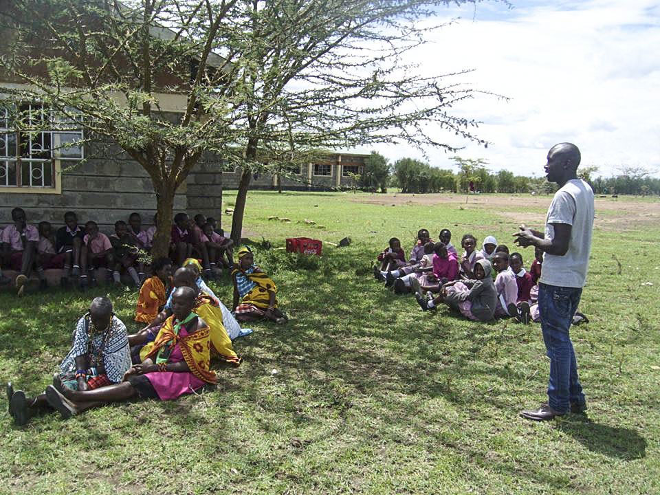 At a primary school talking about importance of preserving wildlife to the local community.